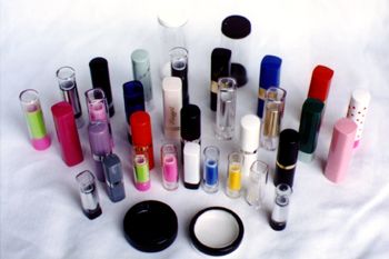 A selection of cosmetic containers, pots, and lipstick cases